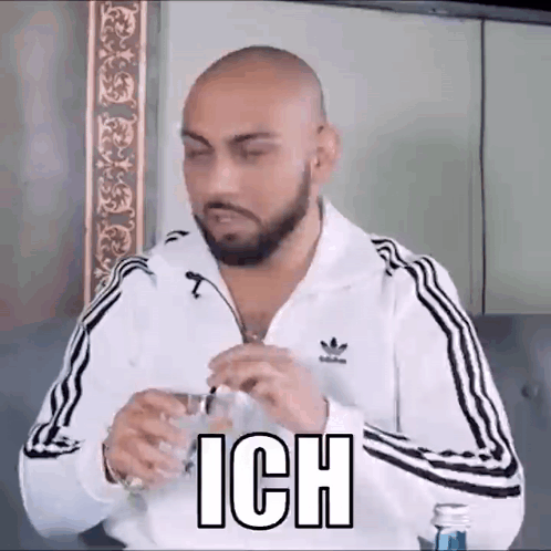 Bald Bearded Man With Glass Of Water GIF