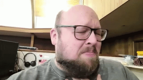 Bald Bearded Man With Glasses And Headphones GIF