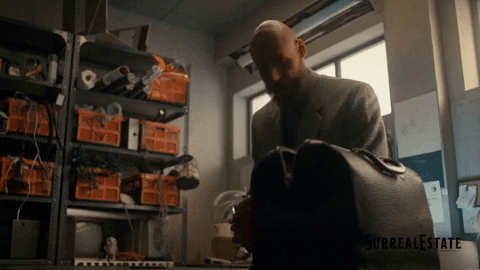 Bald Guy Packing Bags GIF