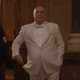 Bald Man Adjusting White Tuxedo