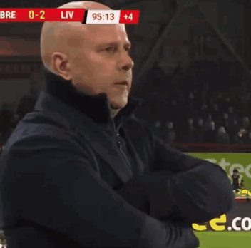 Bald Man Arms Crossed Soccer Field Scoreboard Liv