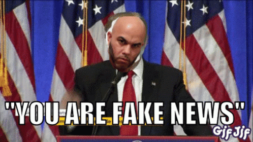 Bald Man at Podium You Are Fake News