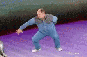 Bald Man Dancing On Purple Surface GIF