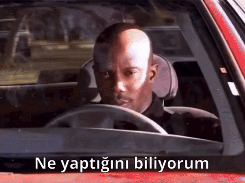 Bald Man Driving Red Car With Ne Yaptığını Biliyorum
