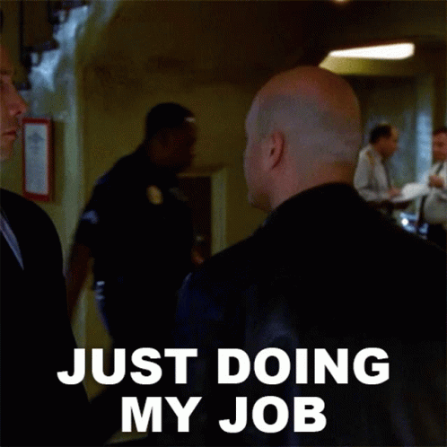 Bald Man in Black Jacket Just Doing My Job