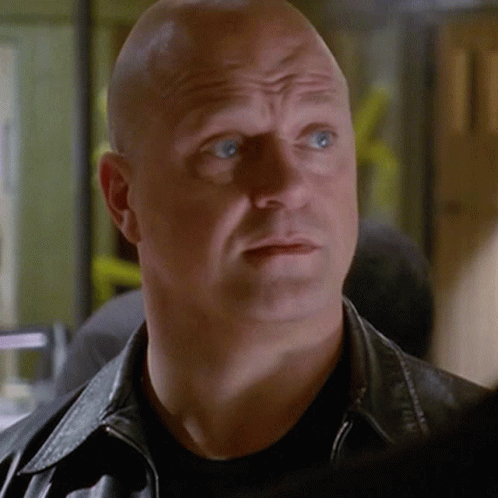 Bald Man in Black Shirt and Black Leather Jacket