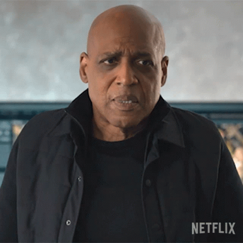 Bald Man in Black Shirt and Jacket with Netflix