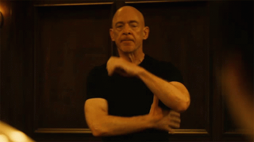 Bald Man in Black Shirt Making Funny Face