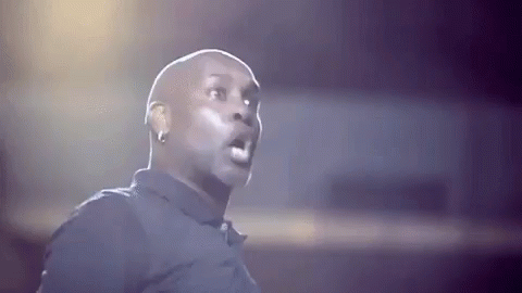 Bald Man in Black Shirt Making Funny Face