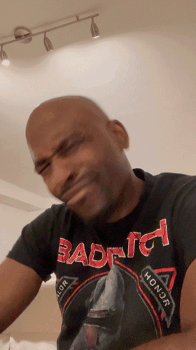 Bald Man In Black Shirt Saying Bad To Honor With Funny Face GIF
