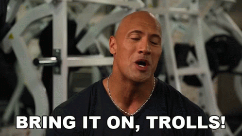 Bald Man In Black Shirt Says Bring It On Trolls GIF