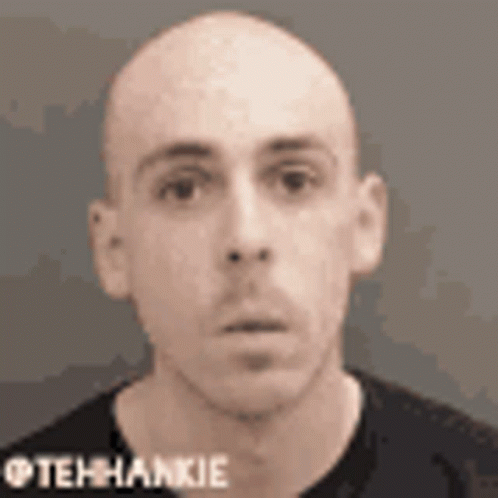 Bald Man in Black Shirt Tehhankie