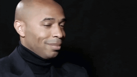 Bald Man in Black Turtleneck and Suit