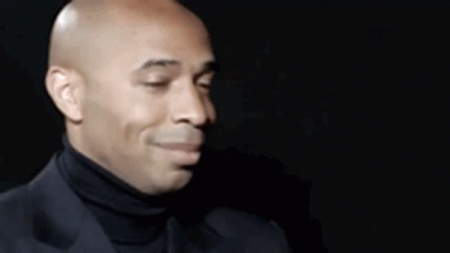 Bald Man in Black Turtleneck and Suit