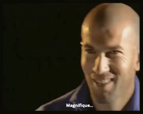Bald Man In Blue Shirt Smiling And Talking GIF