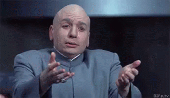 Bald Man in Blue Suit Making Gesture