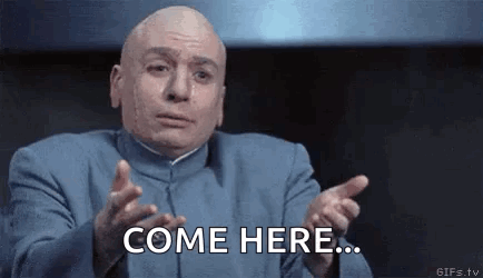 Bald Man in Blue Suit Saying Come Here