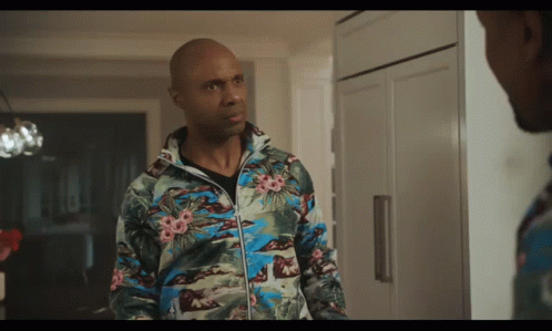 Bald Man in Floral Jacket in Kitchen
