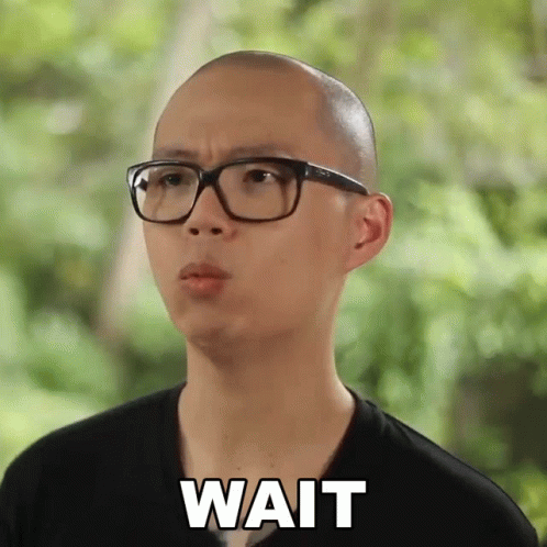 Bald Man In Glasses And Black Shirt Saying Wait GIF