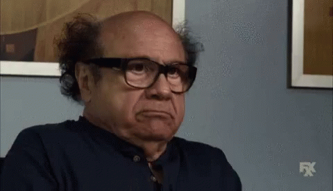 Bald Man In Glasses And Blue Shirt With FX Logo GIF