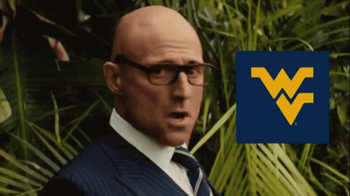 Bald Man in Glasses and Suit with Blue W Logo