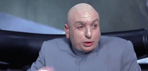 Bald Man In Gray Suit Making Funny Face GIF
