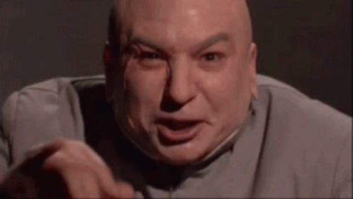 Bald Man in Gray Suit Making Funny Face