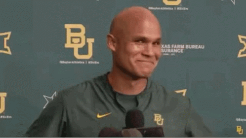 Bald Man in Green Nike Shirt With Letter B