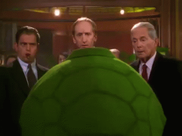Bald Man In Green Suit Saying Hope It's As Fun As The Turtley Club GIF