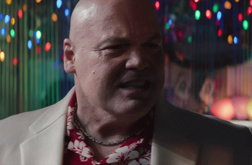 Bald Man in Hawaiian Shirt and Suit