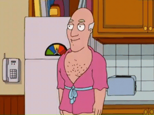 Bald Man In Pink Robe In Kitchen GIF
