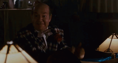 Bald Man In Plaid Shirt Giving Thumbs Up With Coin GIF