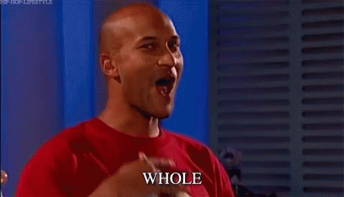 Bald Man in Red Shirt Pointing