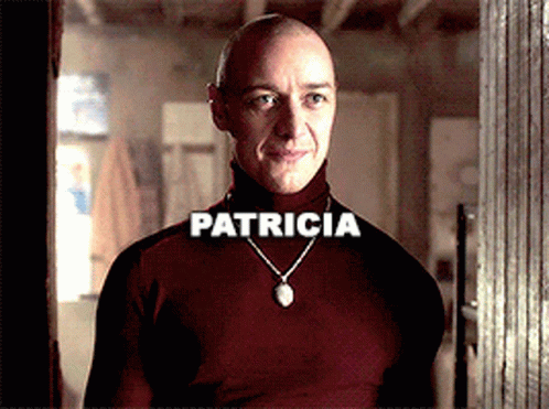Bald Man in Red Turtleneck with Patricia Necklace