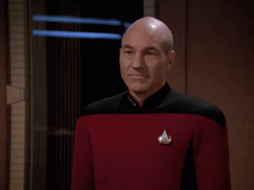 Bald Man in Red Uniform Saying Perhaps Not
