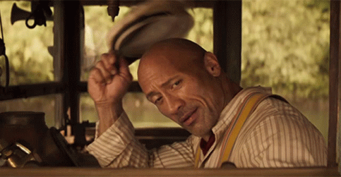 Bald Man In Striped Shirt Suspenders Adjusts Hat GIF
