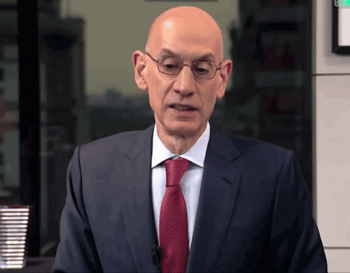 Bald Man In Suit And Tie Before Green Light GIF
