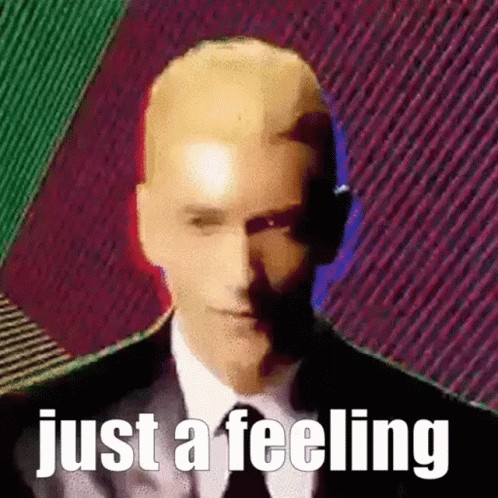 Bald Man in Suit and Tie Just a Feeling