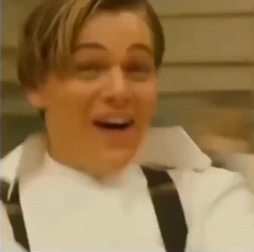 Bald Man In Suit And Tie Making Funny Face On Stage GIF