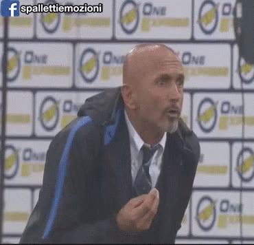 Bald Man in Suit and Tie Saying One