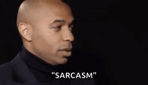 Bald Man in Suit and Turtleneck Saying Sarcasm