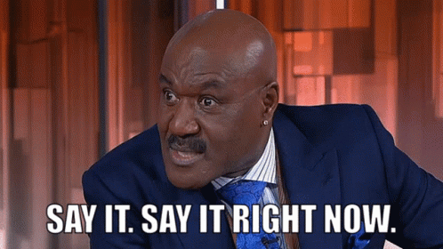 Bald Man in Suit Saying Say It