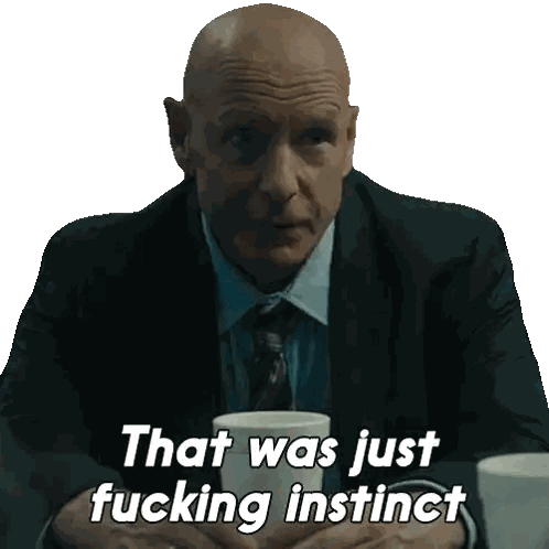 Bald Man in Suit Saying That Was Just Fucking Instinct