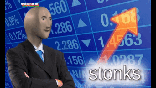 Bald Man in Suit Standing Before Stonks Chart