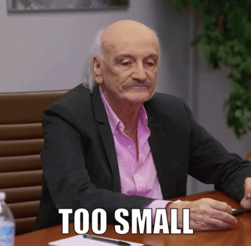 Bald Man in Suit with Too Small Words
