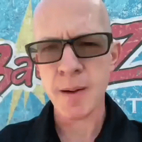 Bald Man in Sunglasses and Black Shirt by Ba Sign
