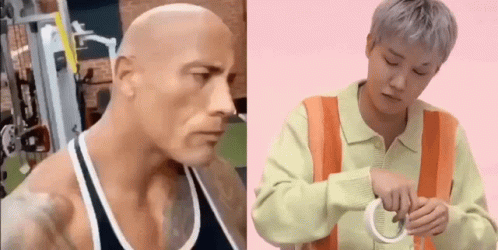 Bald Man in Tank Top Next to Man in Orange Vest