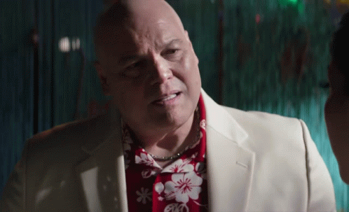 Bald Man in White Suit Saying I Love You