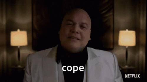 Bald Man in White Suit Says Cope