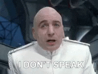 Bald Man in White Uniform Saying I Don't Speak